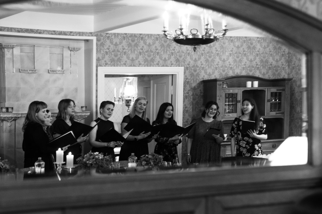 Black and white picture of women singing.